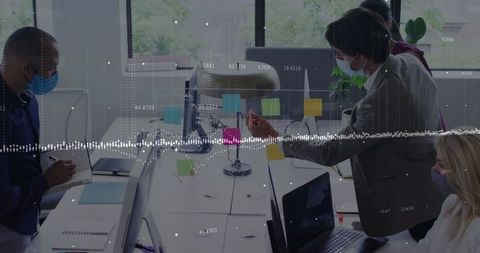 Diverse Team Collaborating in Office with Data Analytics Overlay