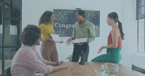 Colleagues Celebrating Awards in Bright Modern Office Holding Certificates and Trophy