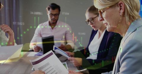 Business Team Analyzing Financial Data with Graph