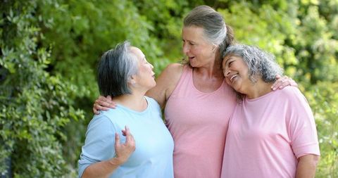 Joyful Senior Friends Embracing Outdoors Smiling Together - Download Free Stock Images Pikwizard.com