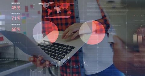 Professionals Analyzing Data on Laptop with Digital Graph Overlays