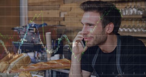 Entrepreneurial barista discussing business at café with stock market graphs