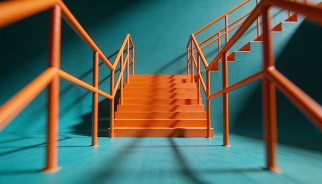 Orange Industrial Stairs Casting Geometric Shadows on Teal Interior with Symmetrical Perspective