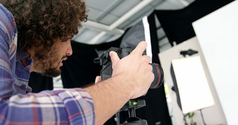 Photographer Focusing Camera in Professional Studio Setup - Download Free Stock Images Pikwizard.com