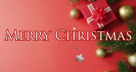 Merry Christmas Greetings with Decorations and Gift Box on Red Background - Download Free Stock Images Pikwizard.com