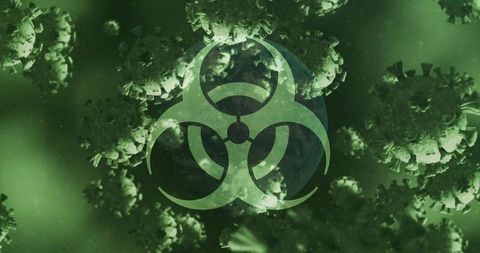 Biohazard symbol overlapping abstract viral particles in green hue