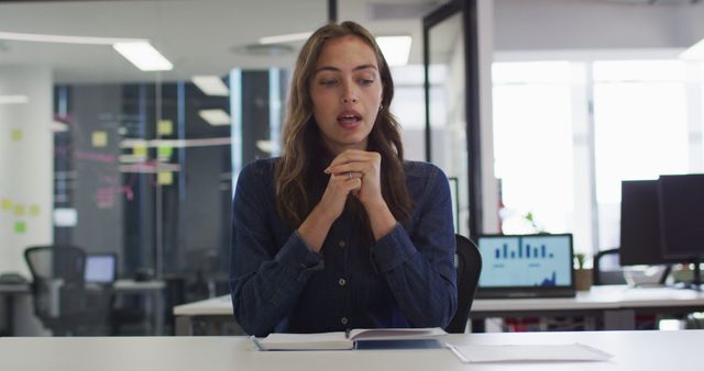 Woman Speaking at Office Desk During Online Meeting - Download Free Stock Images Pikwizard.com