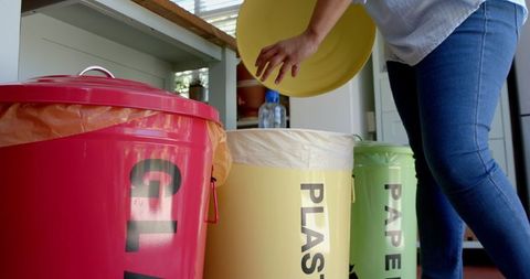 Senior Woman Incorporating Eco-Friendly Waste Segregation at Home