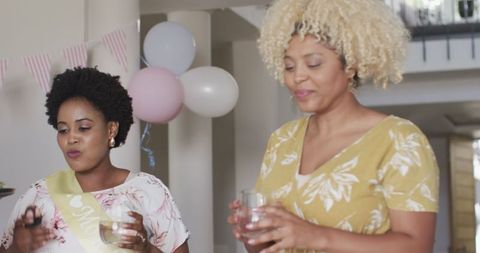 Joyful celebration with friends enjoying drinks and laughter