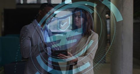 Corporate Professionals Analyzing Digital Security on Tablet Screen