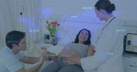Pregnant woman smiling during prenatal examination in clinic
