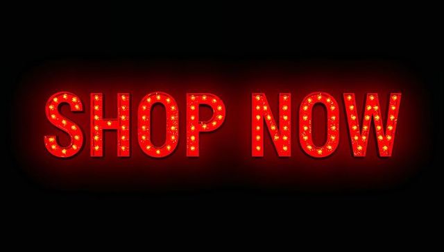 Red Marquee SHOP NOW Sign with Round Bulbs Casting Glowing Halo for Sales Promotion