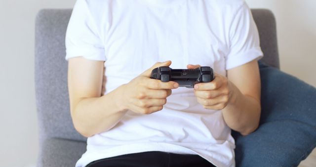 Casual Gamer Holding Controller and Playing Video Game - Download Free Stock Images Pikwizard.com