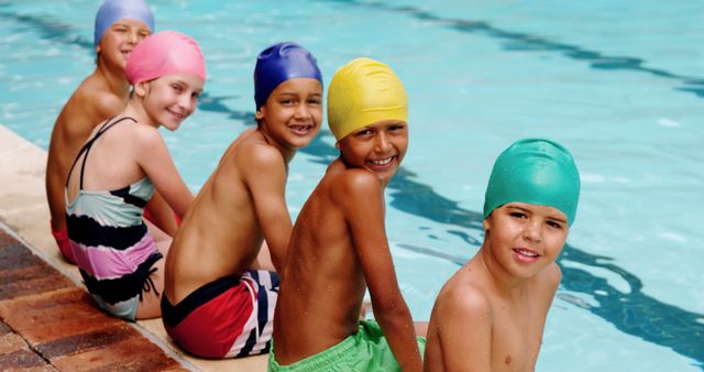 Group of Kids Sitting by Pool in Swimwear and Swimming Caps - Download Free Stock Images Pikwizard.com