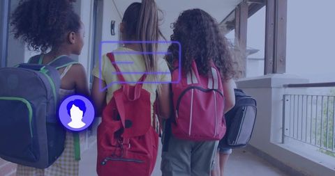Diverse group of girls carrying backpacks walking together