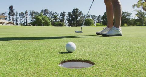 Senior Golfer Preparing Putt on Sunny Day - Download Free Stock Images Pikwizard.com