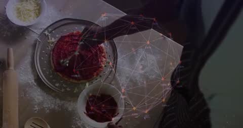 Man Spreading Tomato Sauce on Pizza Crust with Network Data Overlay for Smart Kitchen Video