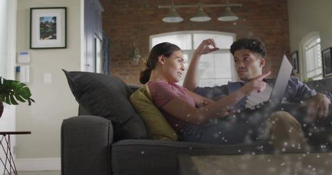 Couple Collaborating on Laptop in Cozy Modern Living Room