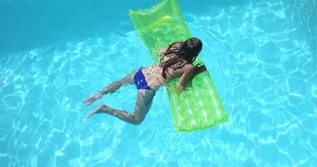 Woman Relaxing on Inflatable Mattress in Outdoor Pool - Download Free Stock Images Pikwizard.com