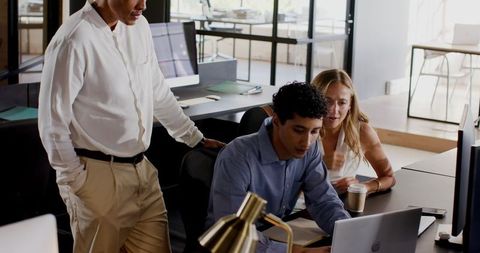 Diverse Professionals Engaged in Collaborative Office Work