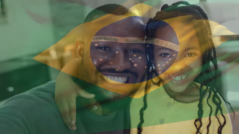 Happy Father and Daughter with Brazilian Flag Overlay