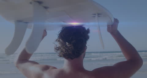 Surfer with Board Walking Toward Ocean for a Day at the Waves