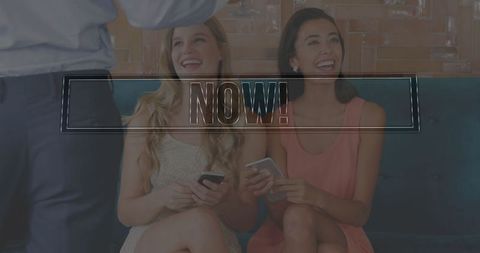 Young women socializing with smartphones on lounge bench