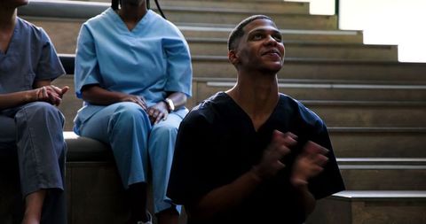 Smiling healthcare professional accepting award applause