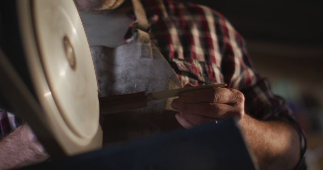 Close-Up of Artisan Sharpening Knife in Workshop - Download Free Stock Images Pikwizard.com