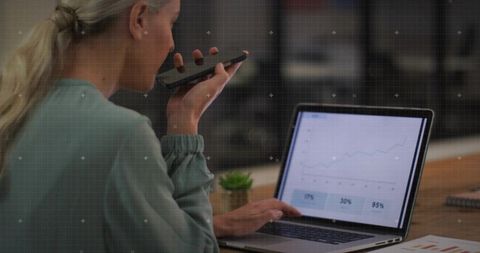 Business professional analyzing growth chart at office desk