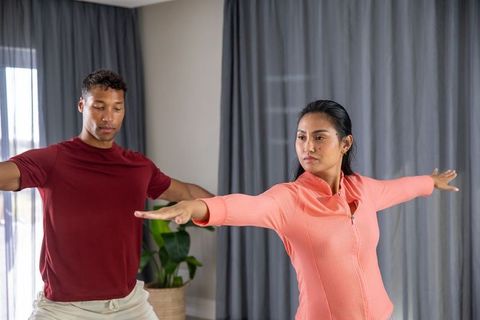 Diverse Pair Practicing Yoga Grooving Human Connection