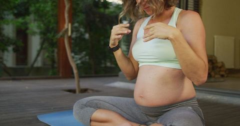Pregnant Woman Practicing Yoga in Peaceful Outdoor Setting