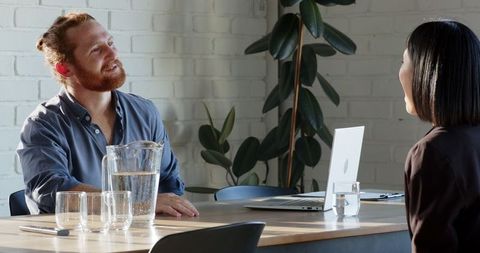 Professional discussion in modern office environment