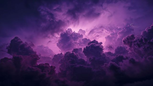 Vibrant purple-illuminated storm clouds in dark sky