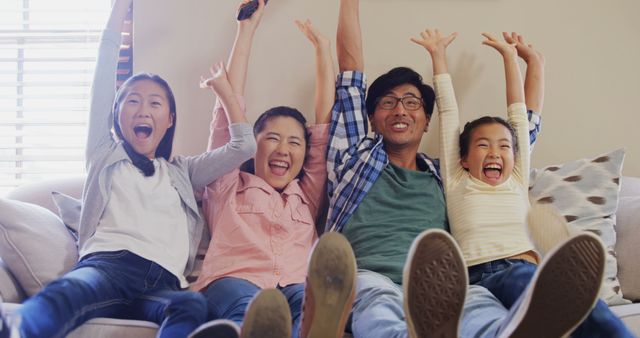 Happy Asian Family Enjoying Leisure Time on Couch - Download Free Stock Images Pikwizard.com