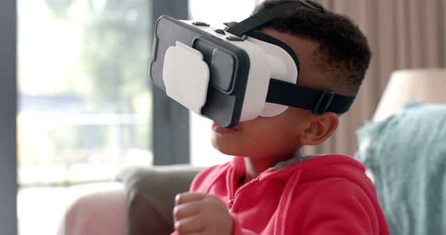 Young Boy Exploring Virtual Reality with VR Headset in Living Room - Download Free Stock Images Pikwizard.com