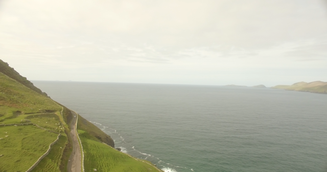 Transparent Coastal Road Overlooking Calm Sea and Clear Sky - Download Free Stock Videos Pikwizard.com