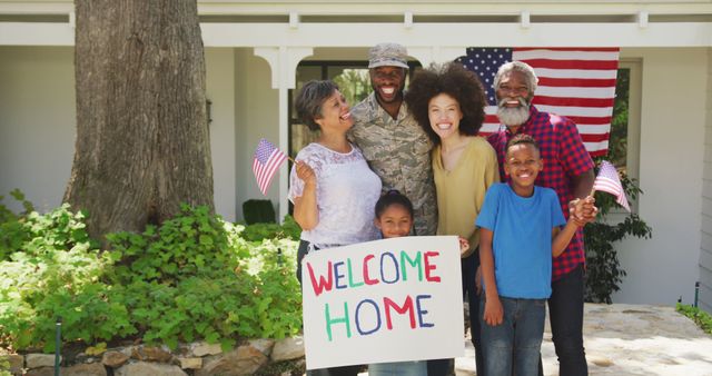 Happy biracial three generation family standing outside home welcoming back soldier father. Military service, family and togetherness.