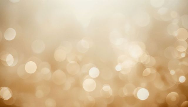 Glowing Warm Golden Bokeh with Soft Orbs and Subtle Grain Backdrop