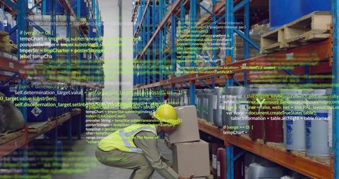 Crouching worker wearing hi-vis vest handling boxes in warehouse with digital code overlay