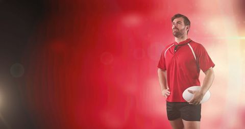 Confident Rugby Player Operating on Red Dramatic Backdrop