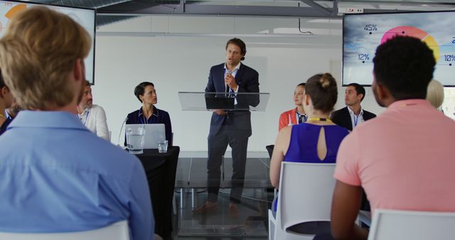 Business Presentation by Confident Speaker in Modern Conference Room - Download Free Stock Images Pikwizard.com