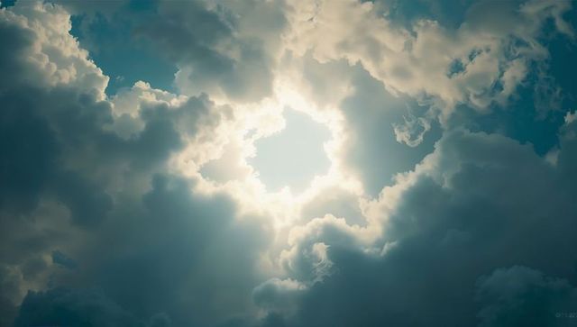 Dramatic Sunlight Piercing Through Dark Clouds