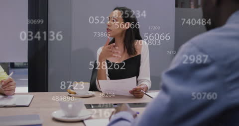 Data Management Conversation in Modern Office Meeting