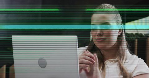 Focused Businesswoman Working on Laptop