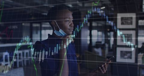 Businesswoman Analyzing Financial Data with Face Mask During COVID-19
