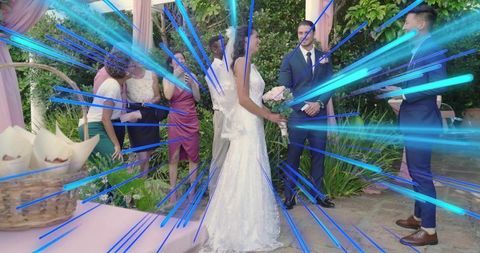 Bride holding bouquet during outdoor wedding ceremony with soft blue light streaks