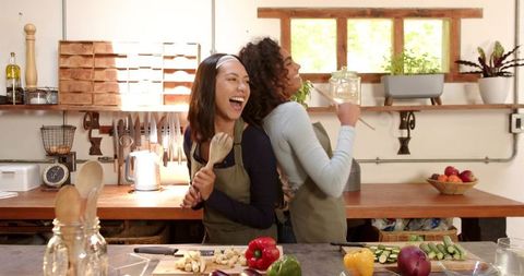 Diverse Friends Joyfully Preparing Meal Kitchen Countertop Fun
