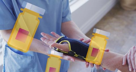 Nurse assisting senior woman with arm exercise therapy
