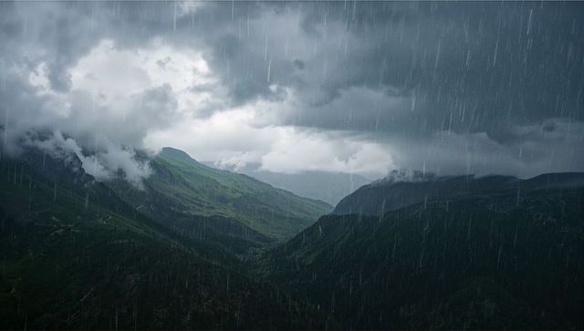 Stormy Raindrops Over Misty Mountain Valley